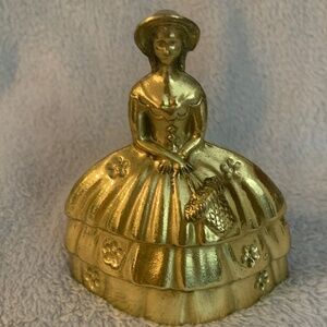 Brass Southern Lady bell, 3.5 inches high.